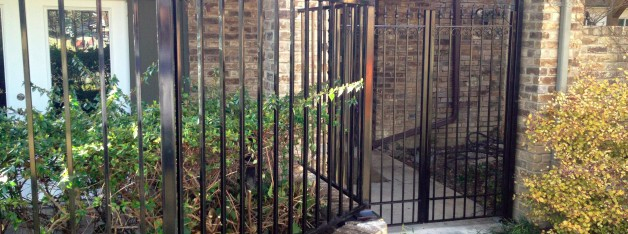 wrought iron pool fence with entry way and latch
